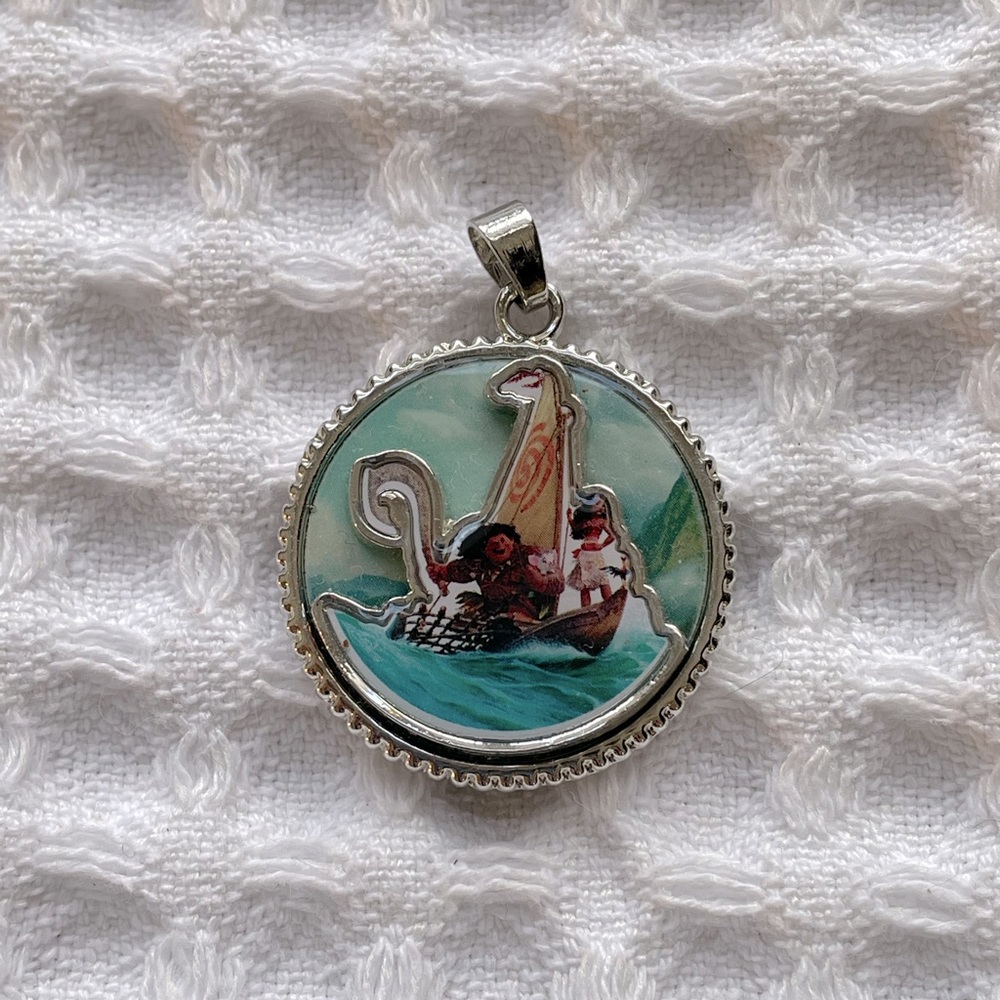 Disney’s Moana pendant featuring Moana, Maui, and Hey Hey
